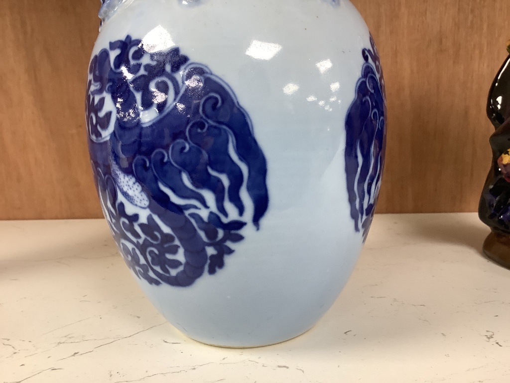 A Chinese blue ground blue and white dragon design vase, 17cm high